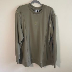 ADIDAS. olive green sweatshirt with gold zipper detail on the shoulders.